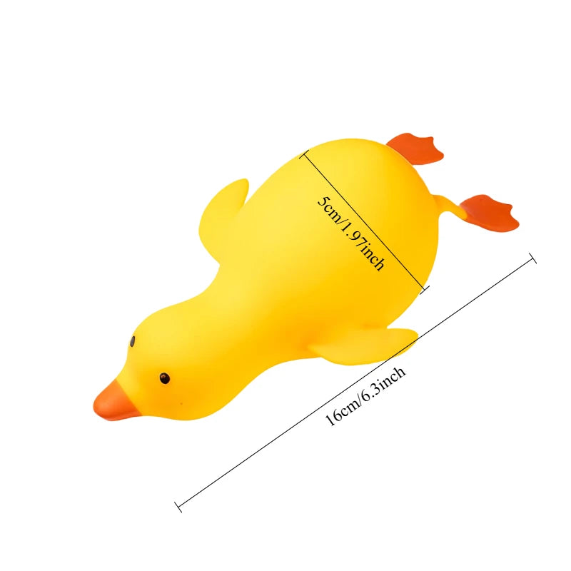 Yellow stretchy duck squishy with orange beak and feet, about 16 cm (6.3 in) long and 5 cm thick