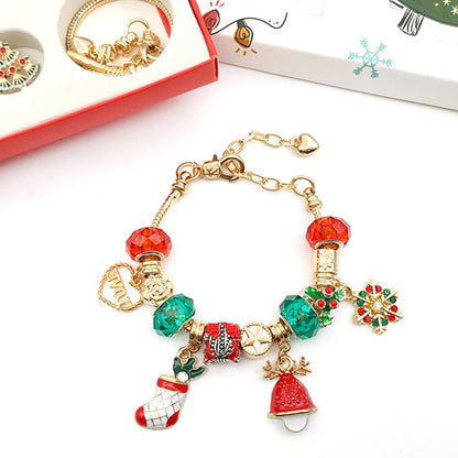 Finished gold-tone charm bracelet with stocking, bell, snowflake and red and green beads