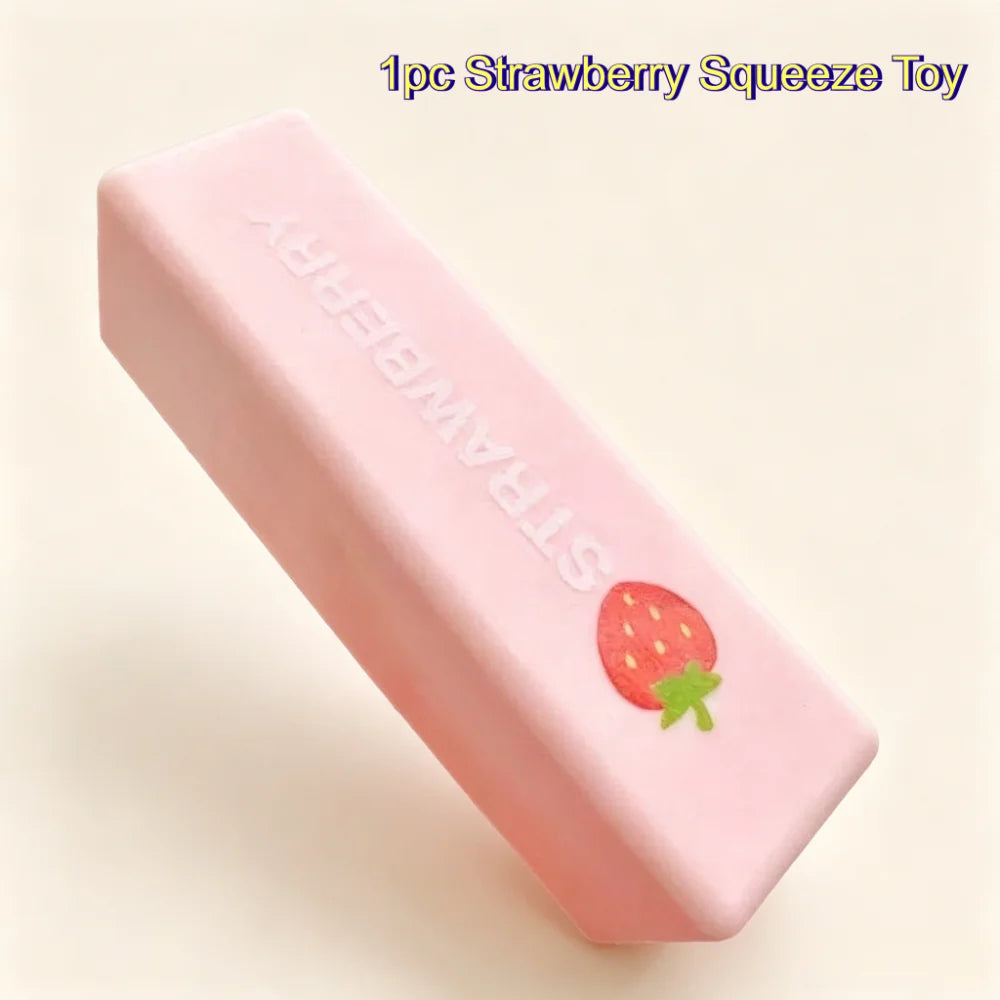 Strawberry style: a pink silicone squeeze stick with "Strawberry" lettering and a little strawberry print