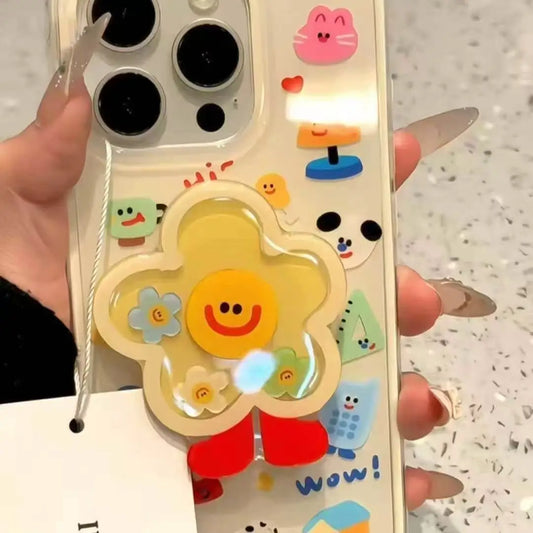 Smiling flower shaker phone grip with red feet on a clear phone case