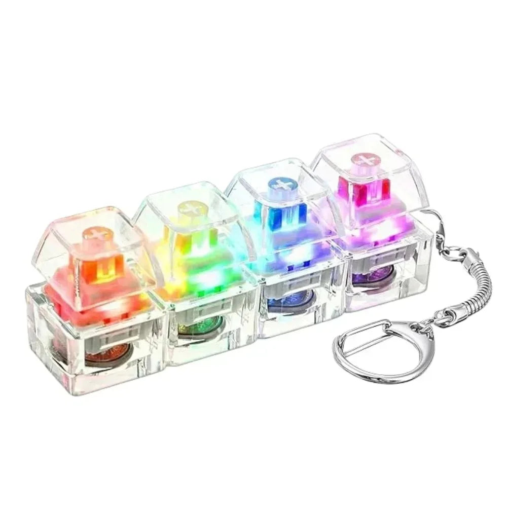 White mini 4-key clicker keychain with clear keys lit up in rainbow colors