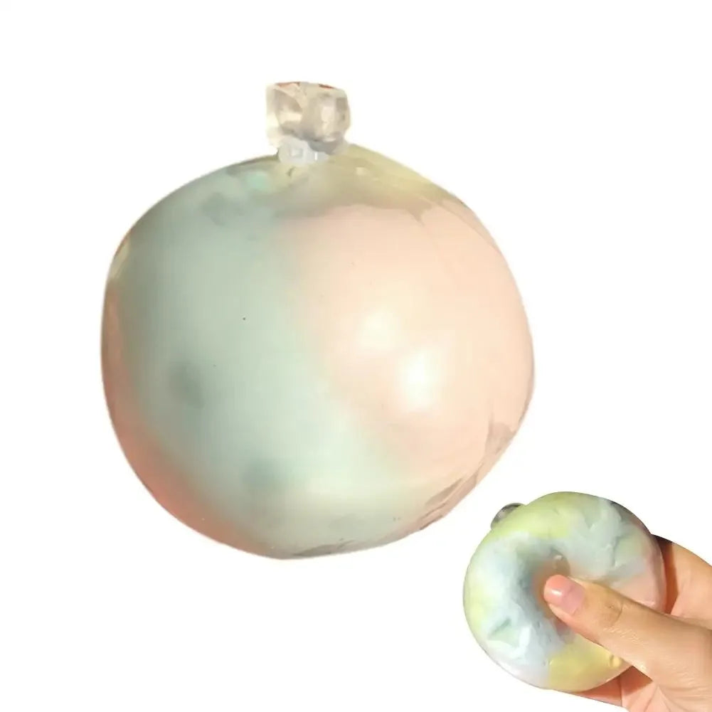 Mint-green and peach marbled wax crack squishy ball, with a hand squeezing one