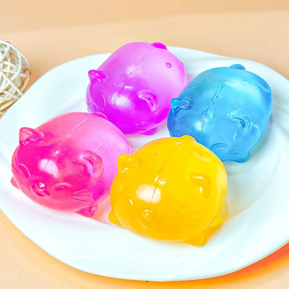Gooey cat squishies in four colors; this listing is the pink cat.