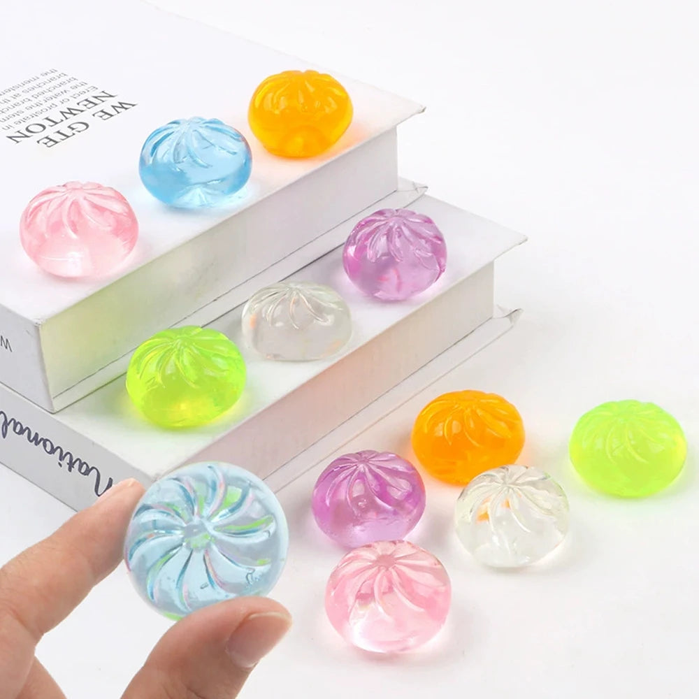 Mini dumpling squishies in pink, blue, orange and green