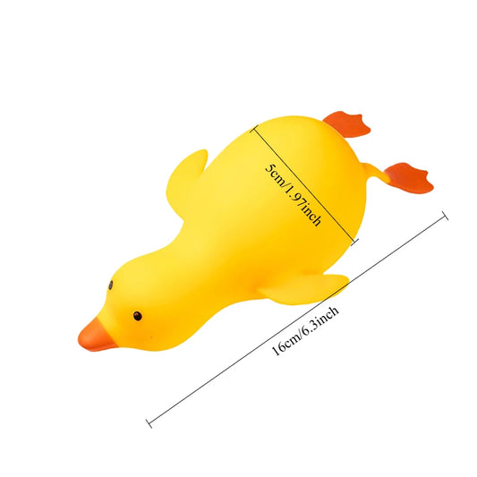 Yellow stretchy duck squishy with orange beak and feet, about 16 cm (6.3 in) long and 5 cm thick
