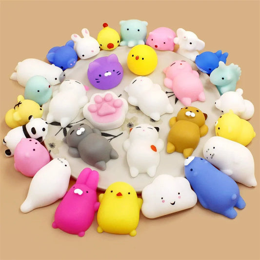 Pile of assorted mini mochi animal squishies: seals, bunnies, chicks, cats and clouds (styles vary)