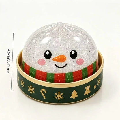 Snowman dumpling squishy in a green holiday steamer cup, about 8.5 cm tall (one of the random designs)