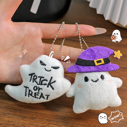 Trick or Treat plush ghost keychain (left) next to a witch-hat ghost style