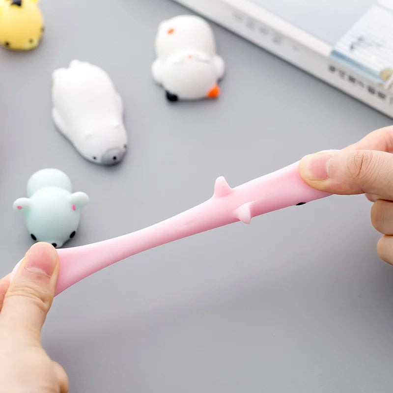 Hands stretching a pink mochi squishy to show how soft and stretchy it is