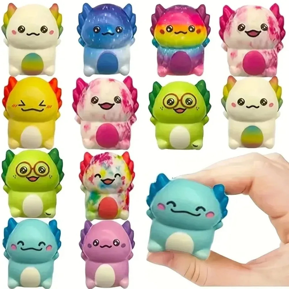 Assorted mini newt squishies with one blue newt held between fingers for size