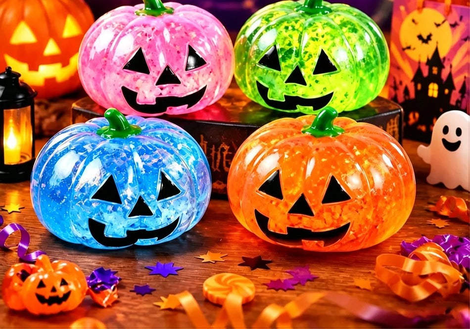 Glitter jack-o'-lantern dumpling squishies in pink, green, blue and orange (one random design per order)