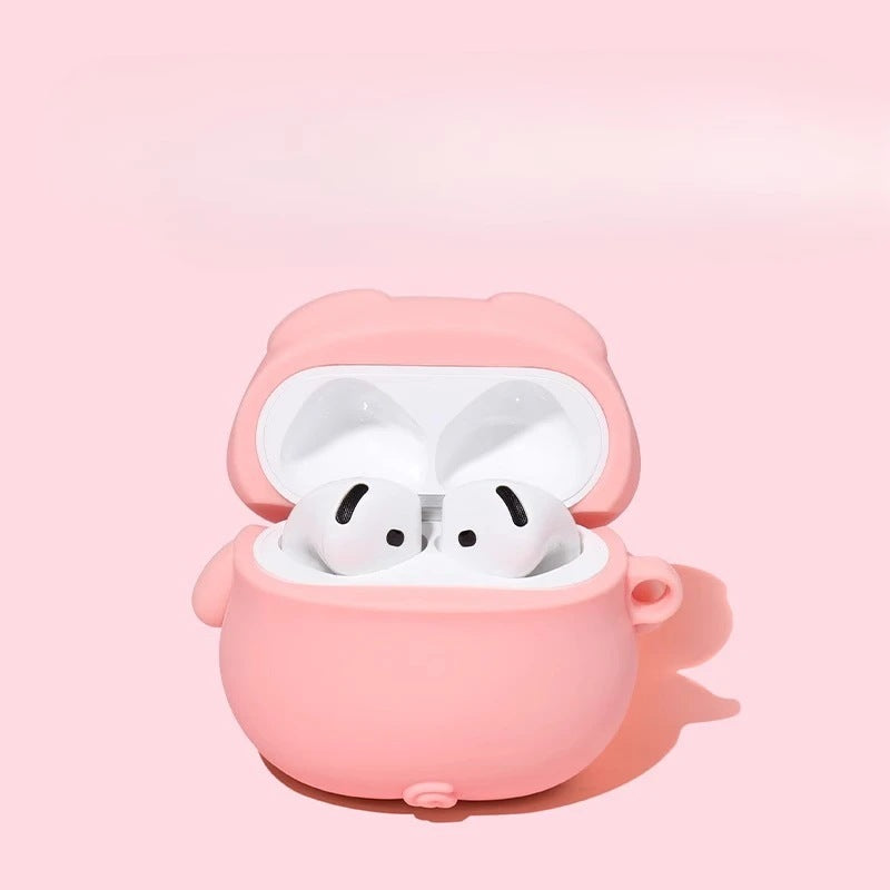 Pink pig earbud case open with earbuds inside