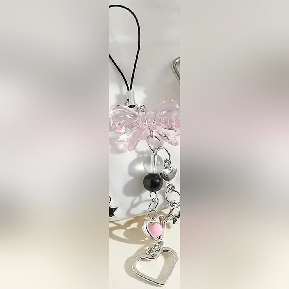 Pink bow beaded phone charm strap with its phone loop cord, heart and star charms