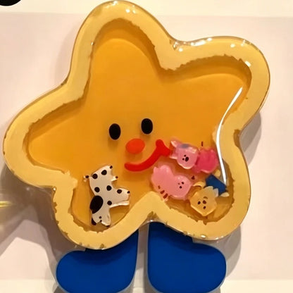 Yellow star shaker phone grip with blue feet